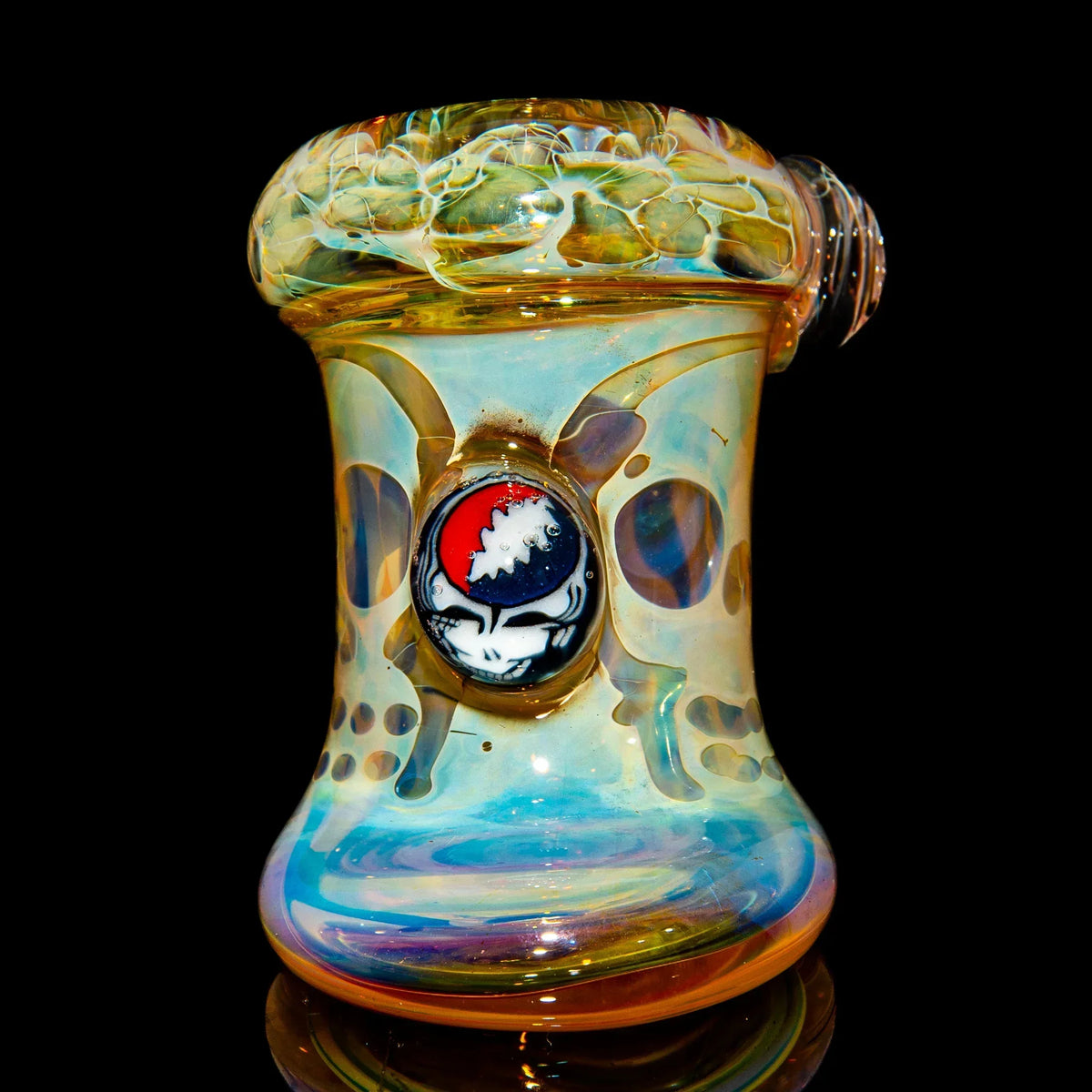 Heady glass water pipe with colorful swirl design and unique emblem detail on black background