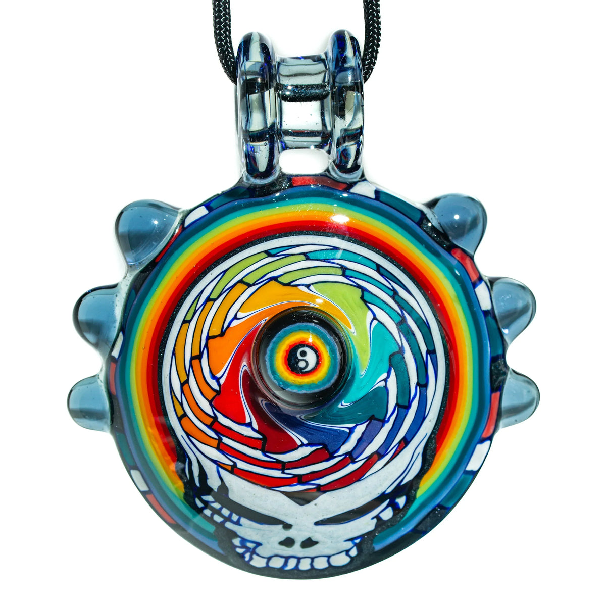 Large glass pendant with rainbow spiral design and skull motif on a black cord