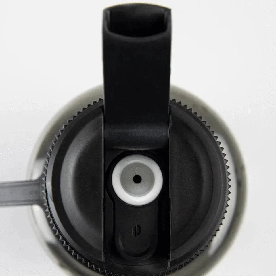 Close-up of water bottle lid with built-in mouthpiece and silicone seal for smoke accessory