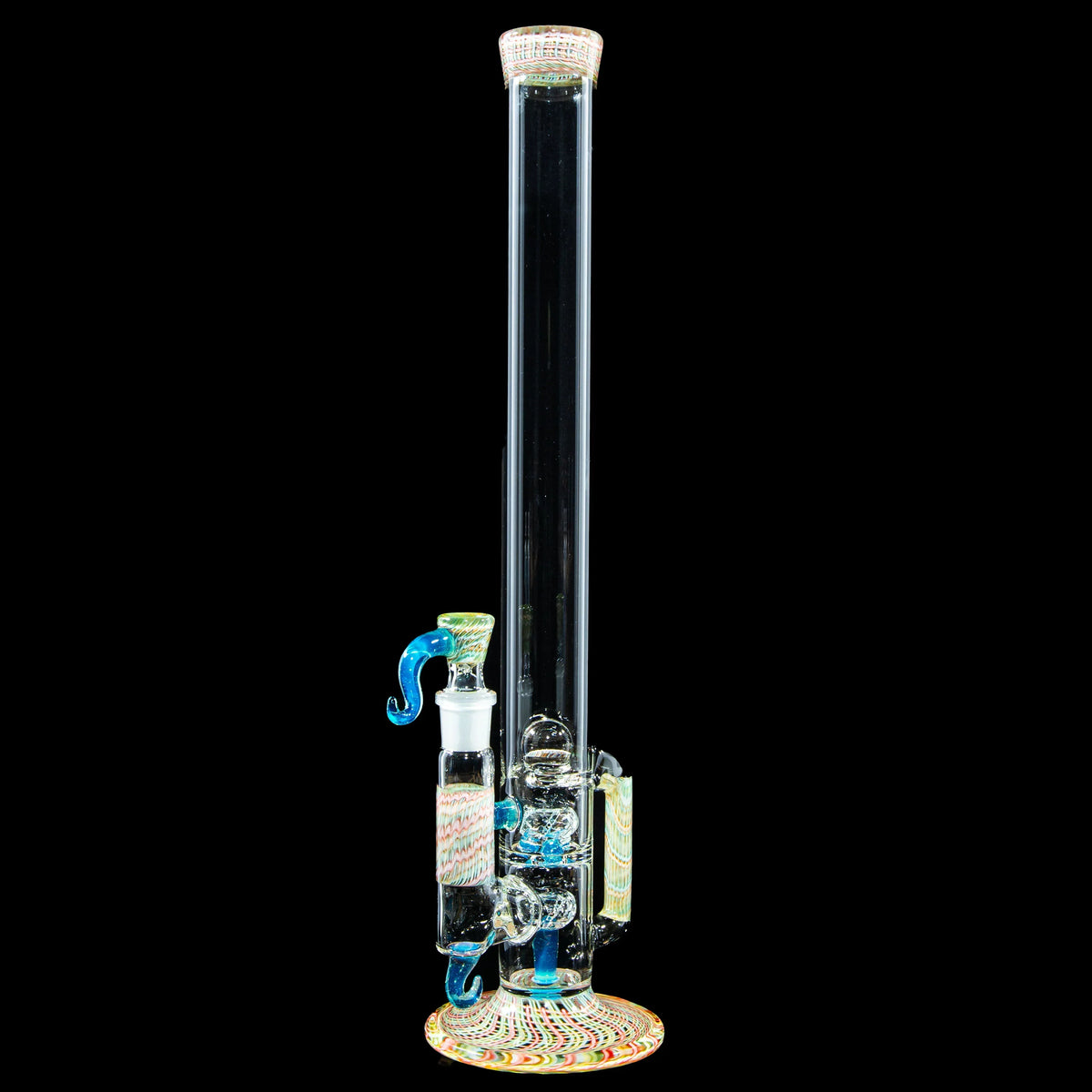 Tall heady glass water pipe with colorful accents and intricate design on a black background