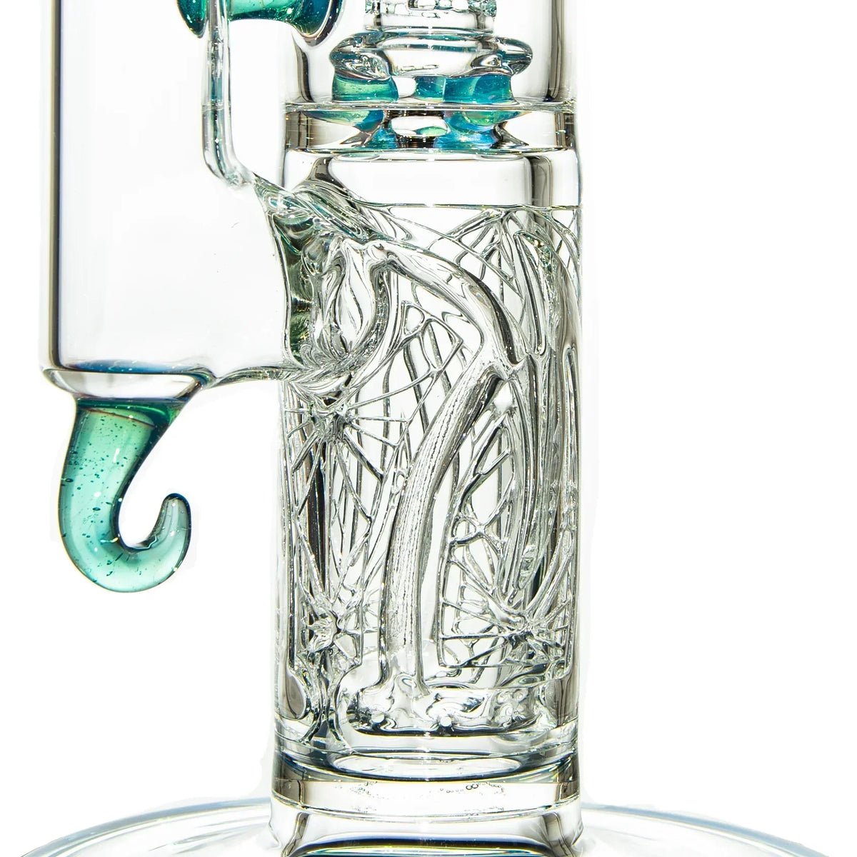 Close-up of intricate clear glass water pipe with teal accents and detailed glasswork.
