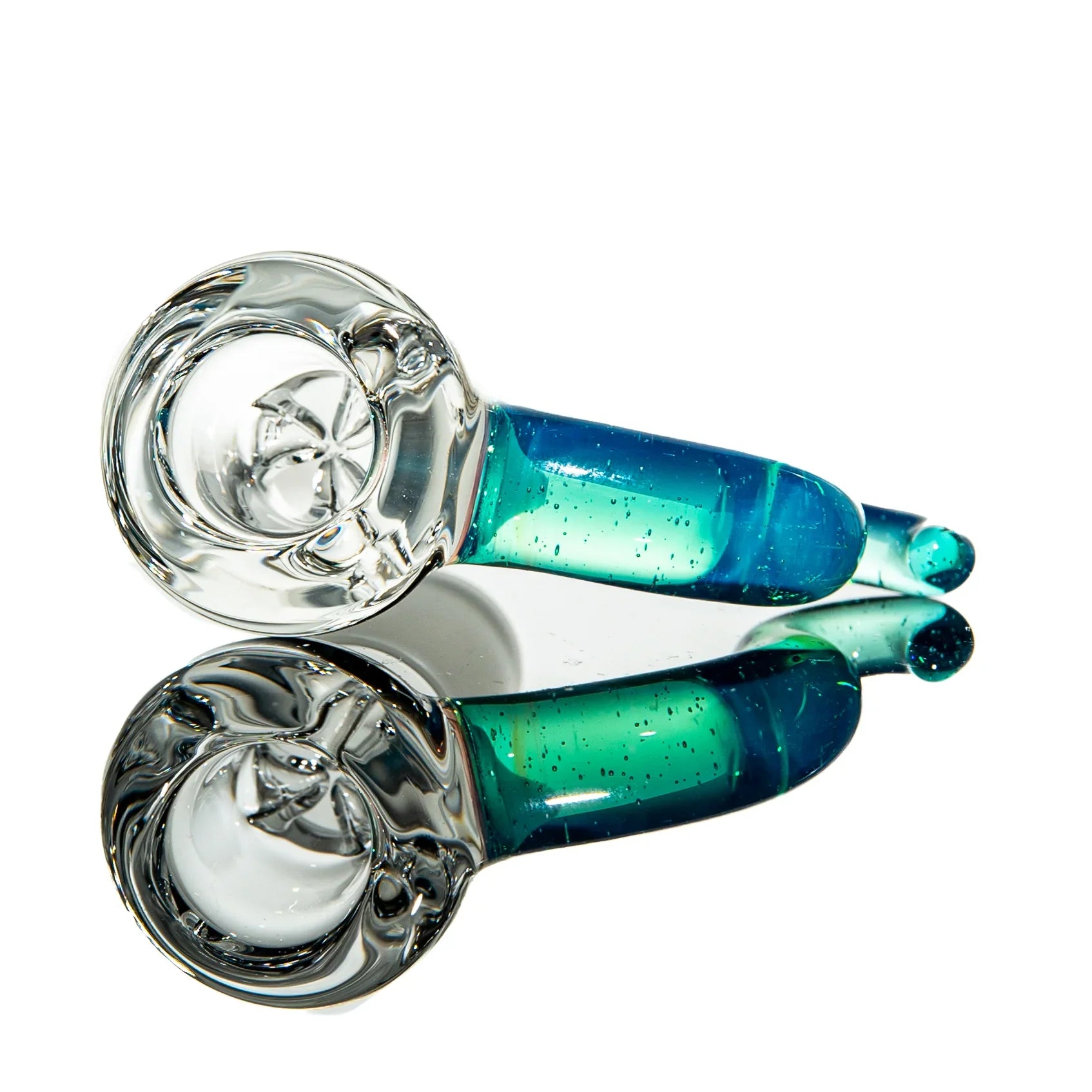 Clear and blue glass hand pipe with reflection on a white background
