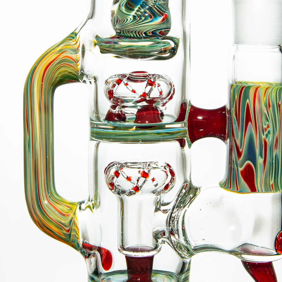 Close-up of a colorful glass water pipe with intricate details and red accents