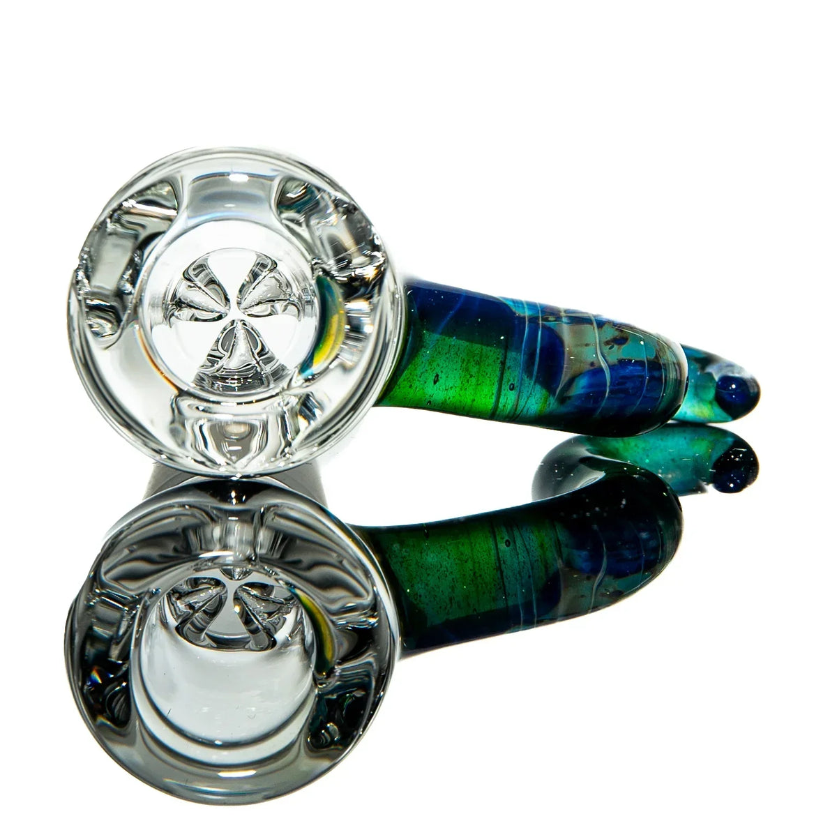 Colorful glass hand pipe with blue and green swirls on reflective surface