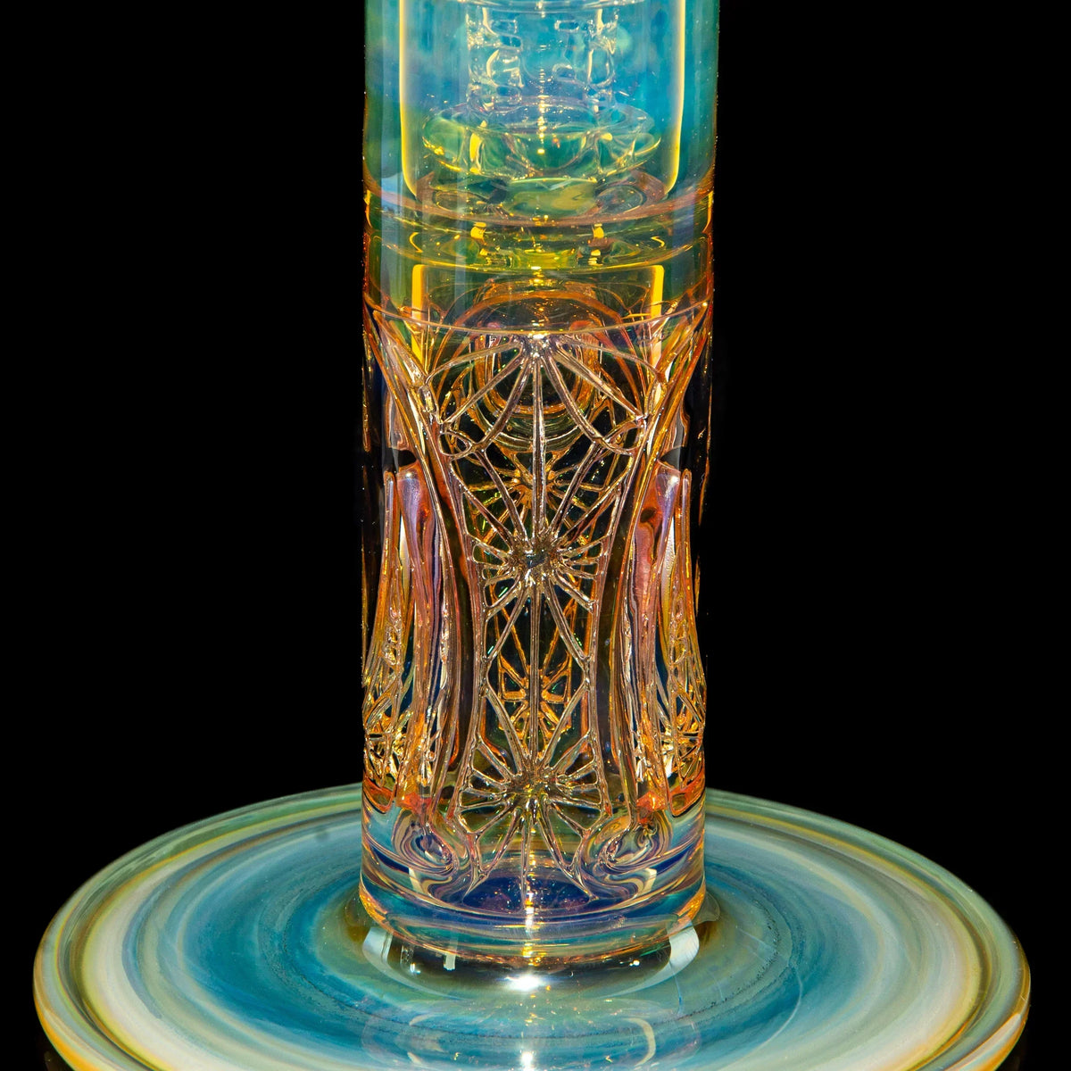 Intricately designed glass water pipe with colorful, detailed patterns and a swirled base.