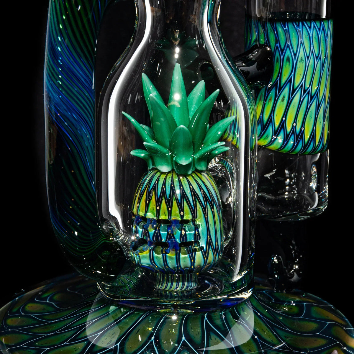 Intricate glass water pipe featuring a colorful pineapple percolator design