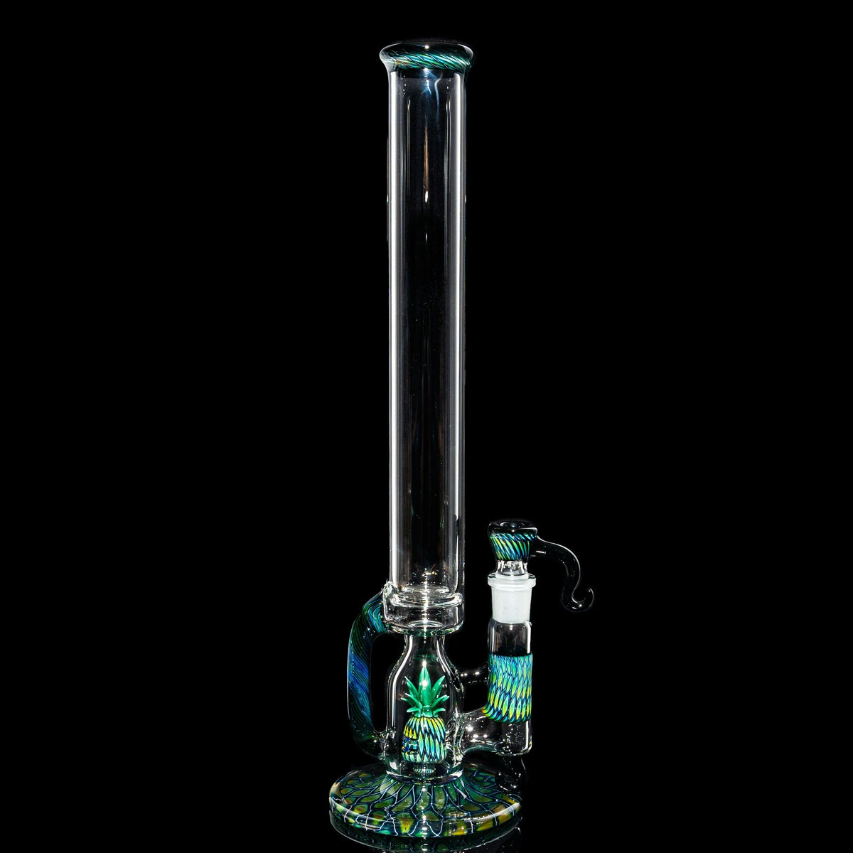 Heady glass water pipe with intricate green and blue designs on a black background