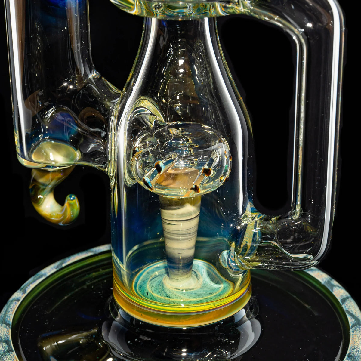 Close-up of intricate heady glass water pipe with detailed percolator and swirling colors