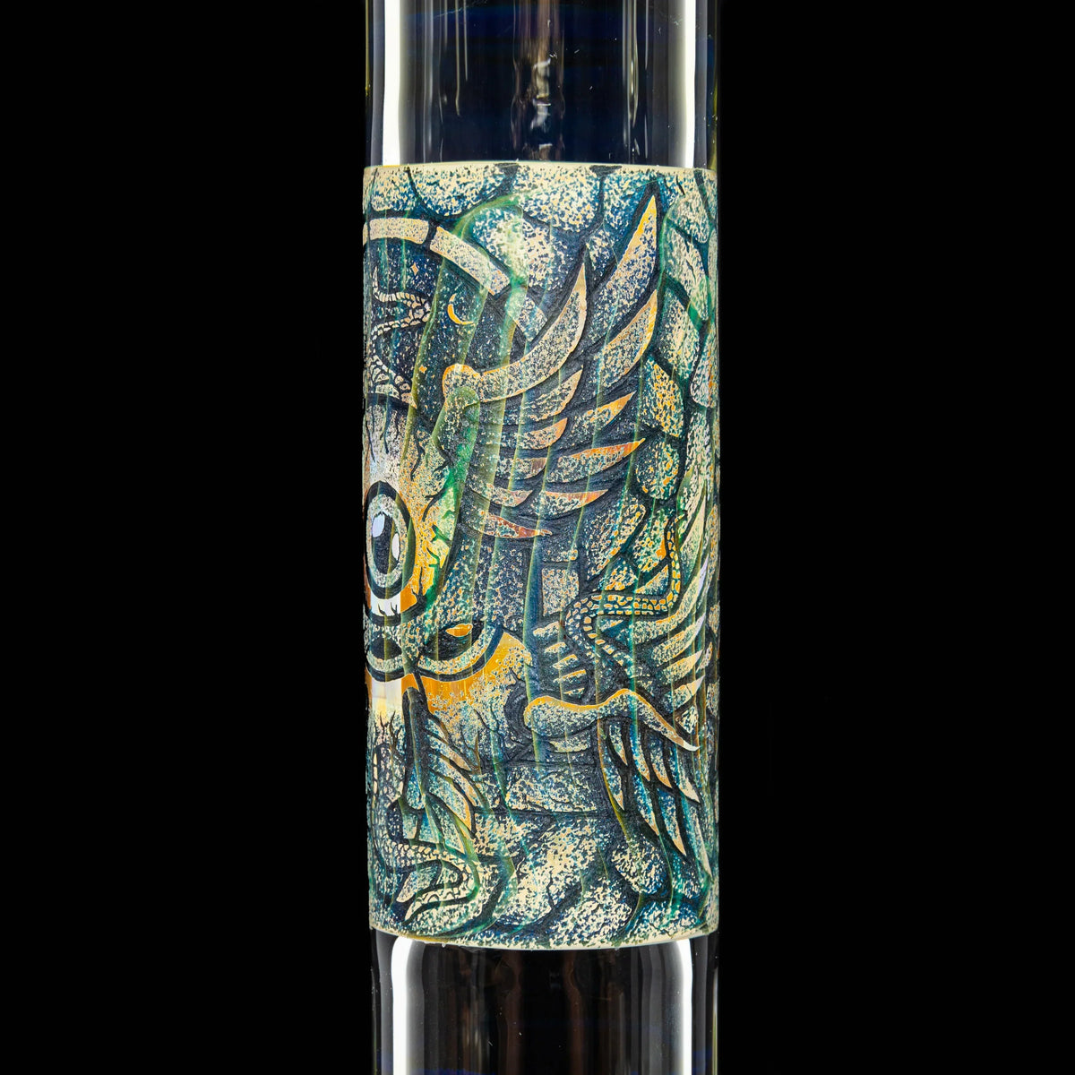 Close-up of a glass water pipe with intricate, colorful winged eye artwork on the tube