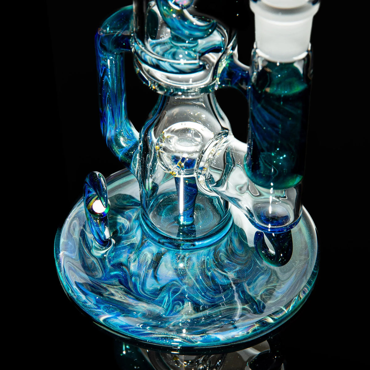 Intricate blue and clear glass water pipe with swirling patterns and unique design details