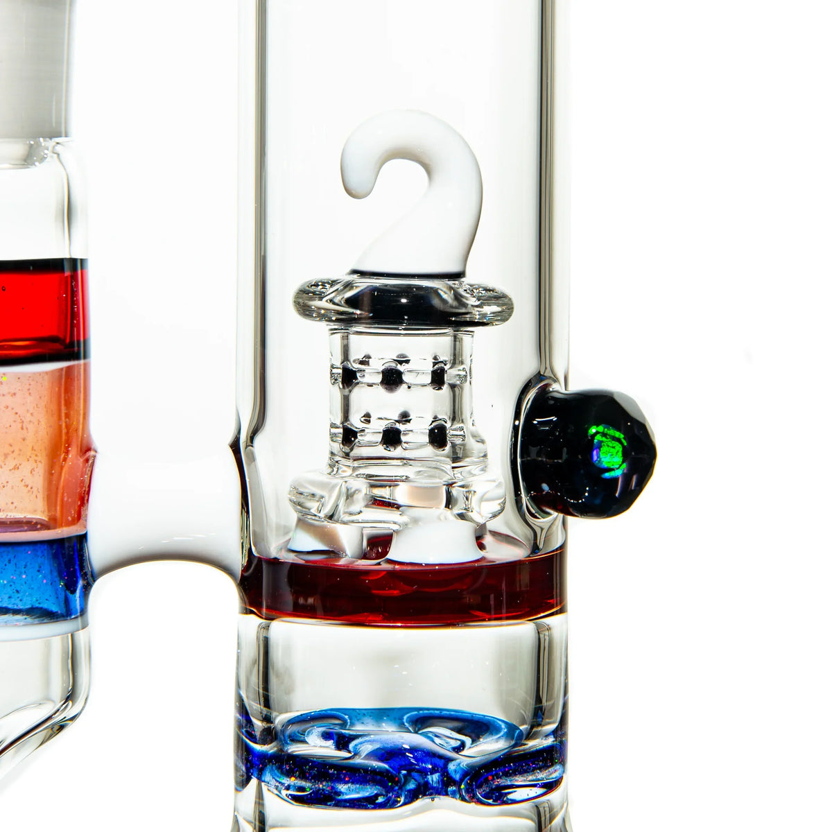 Close-up of artistic glass water pipe with colorful accents and intricate percolator