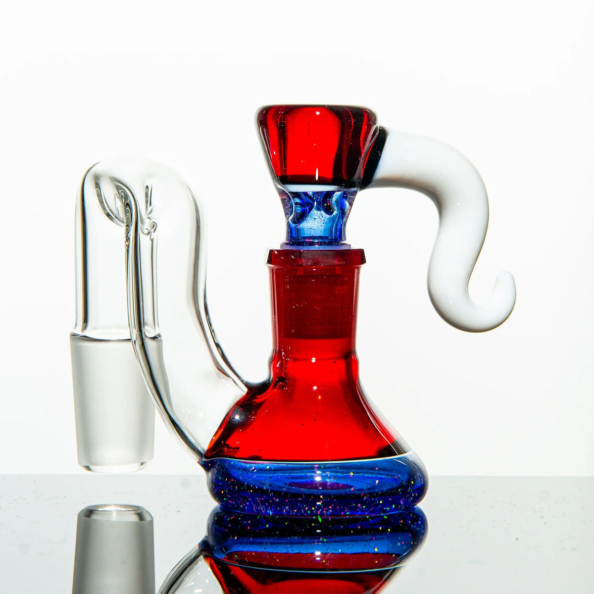 Artistic red and blue glass water pipe with a unique white and clear mouthpiece