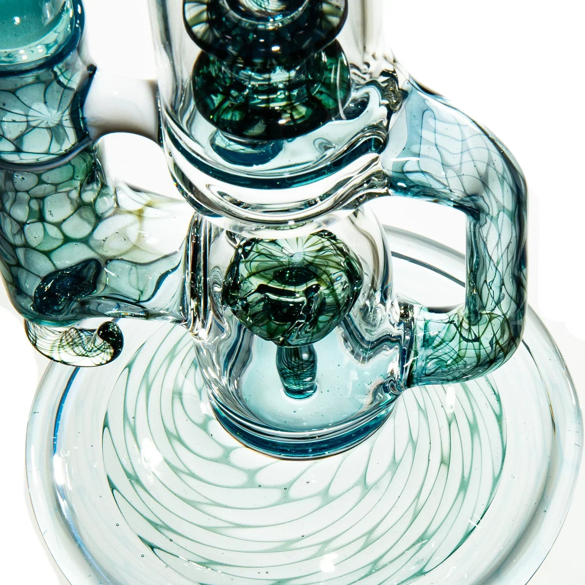 Artistic glass water pipe with blue and green swirls, intricate recycler design