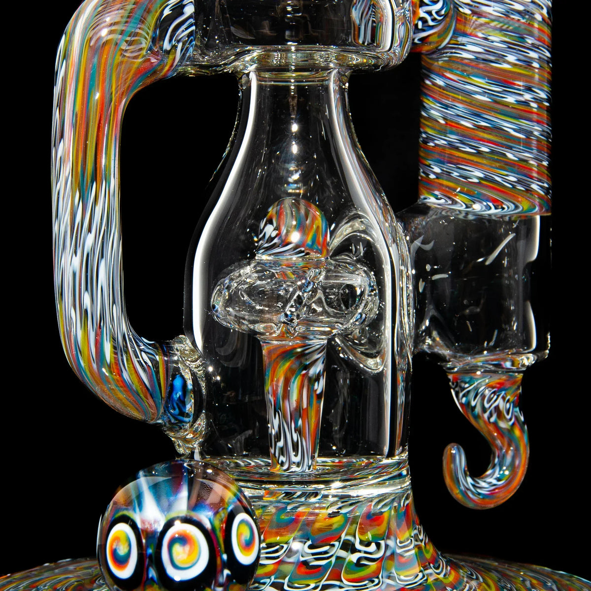 Intricate heady glass water pipe with vibrant rainbow swirls and marble accents on black background
