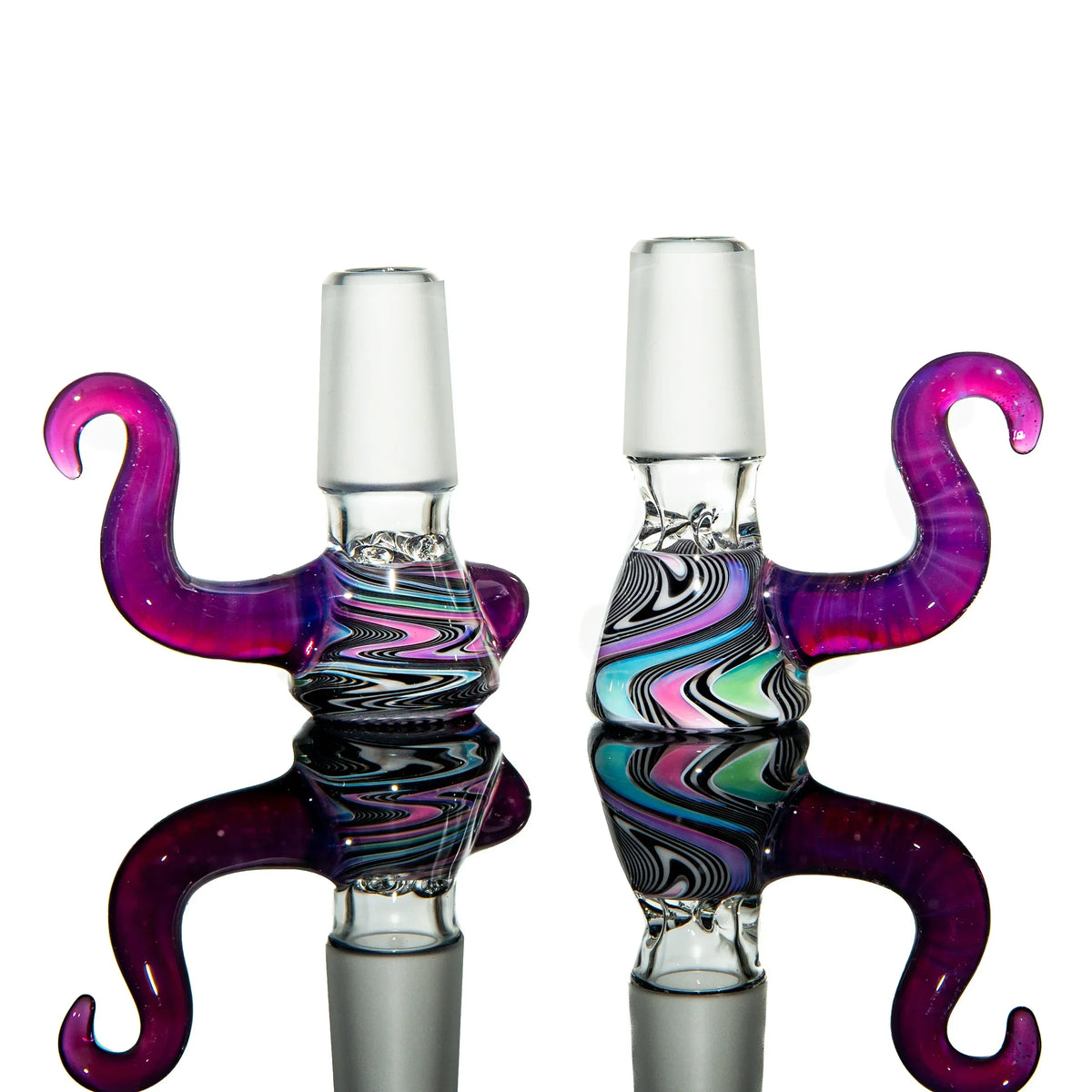 Colorful glass slide adapters with swirled designs and purple handles for water pipes