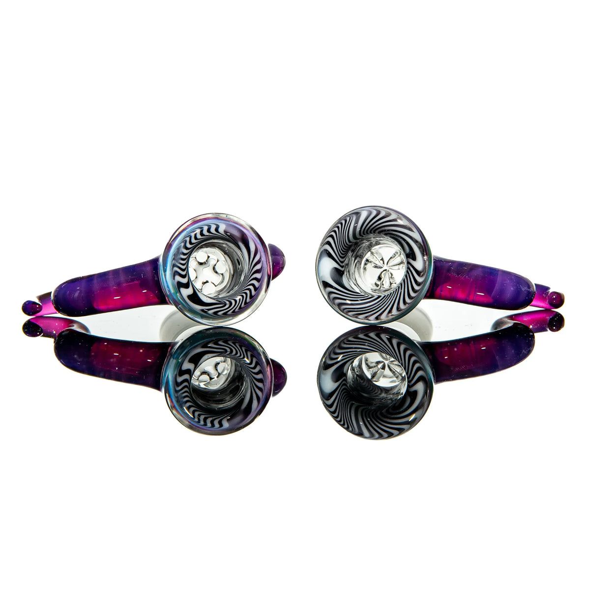 Two colorful glass hand pipes with black and white swirl designs and purple accents, mirrored on white background