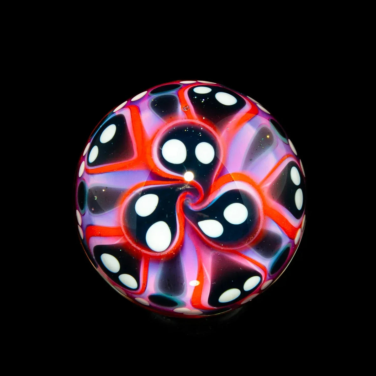 Colorful heady glass marble with psychedelic red, purple, and black swirl design