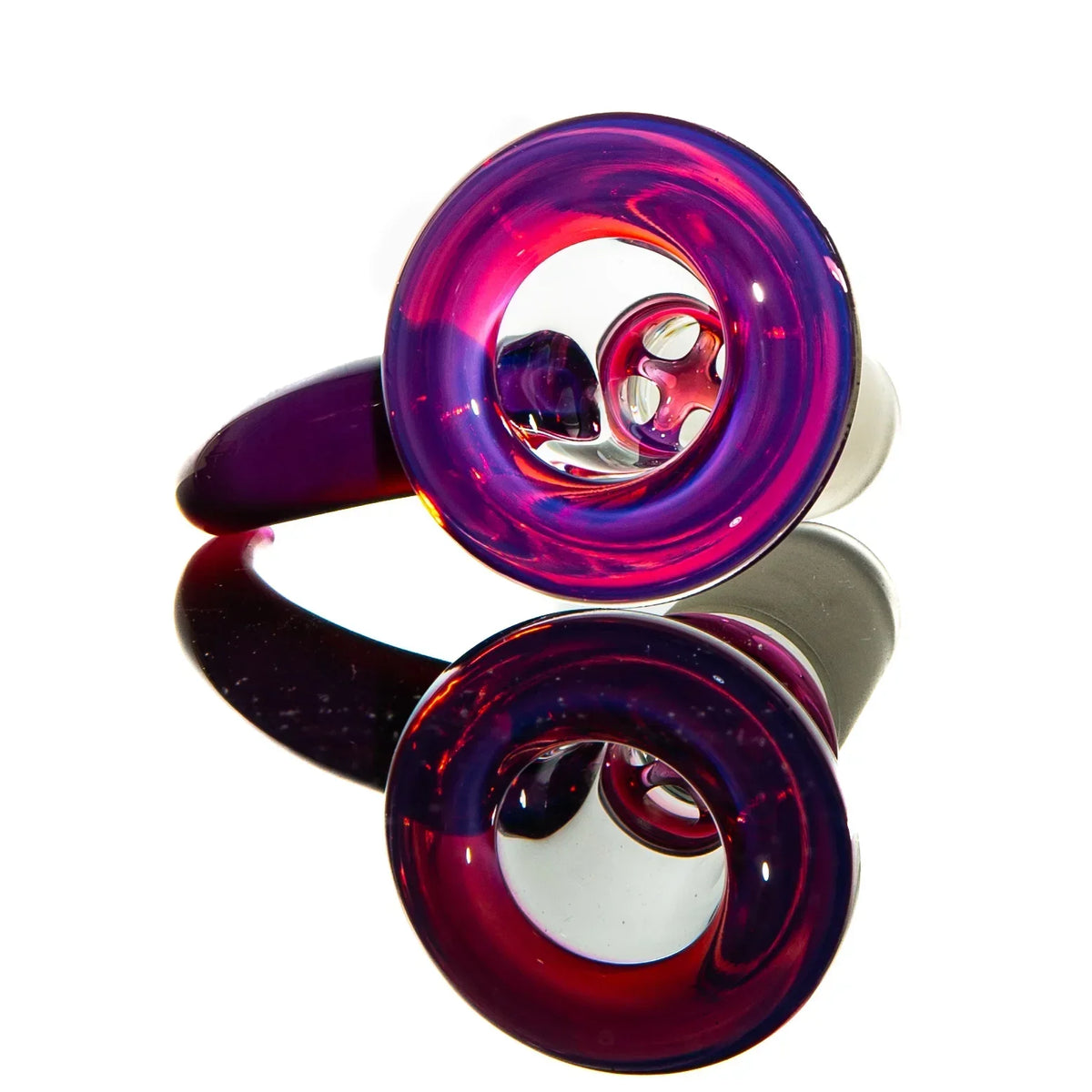 Colorful glass hook bowl accessory with vibrant pink and purple swirls on a mirrored surface