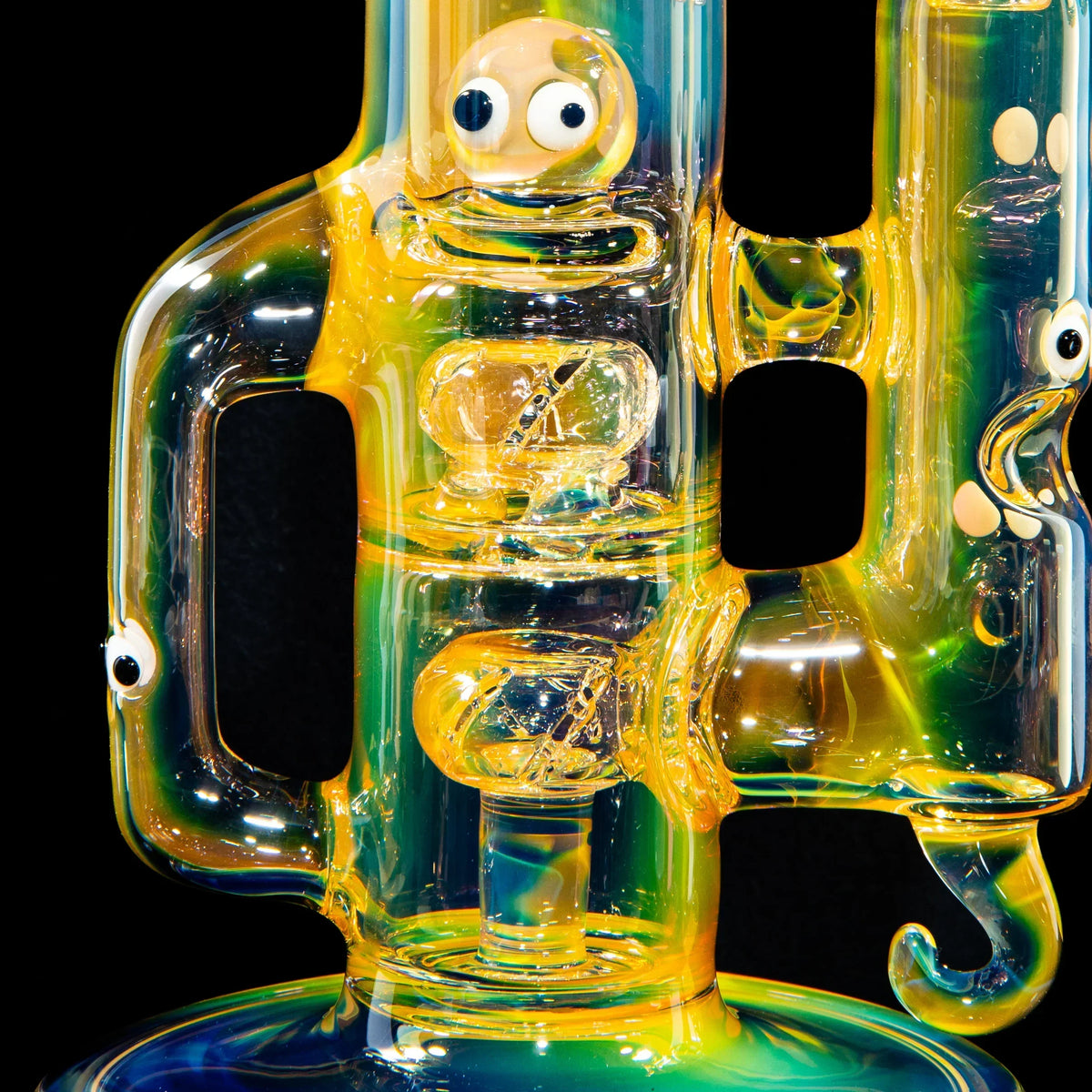 Heady glass water pipe with colorful catfish design, sculpted details, and cartoon eyes