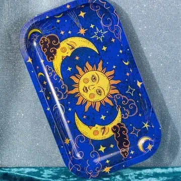 Celestial rolling tray with sun, moon, and stars on a blue background