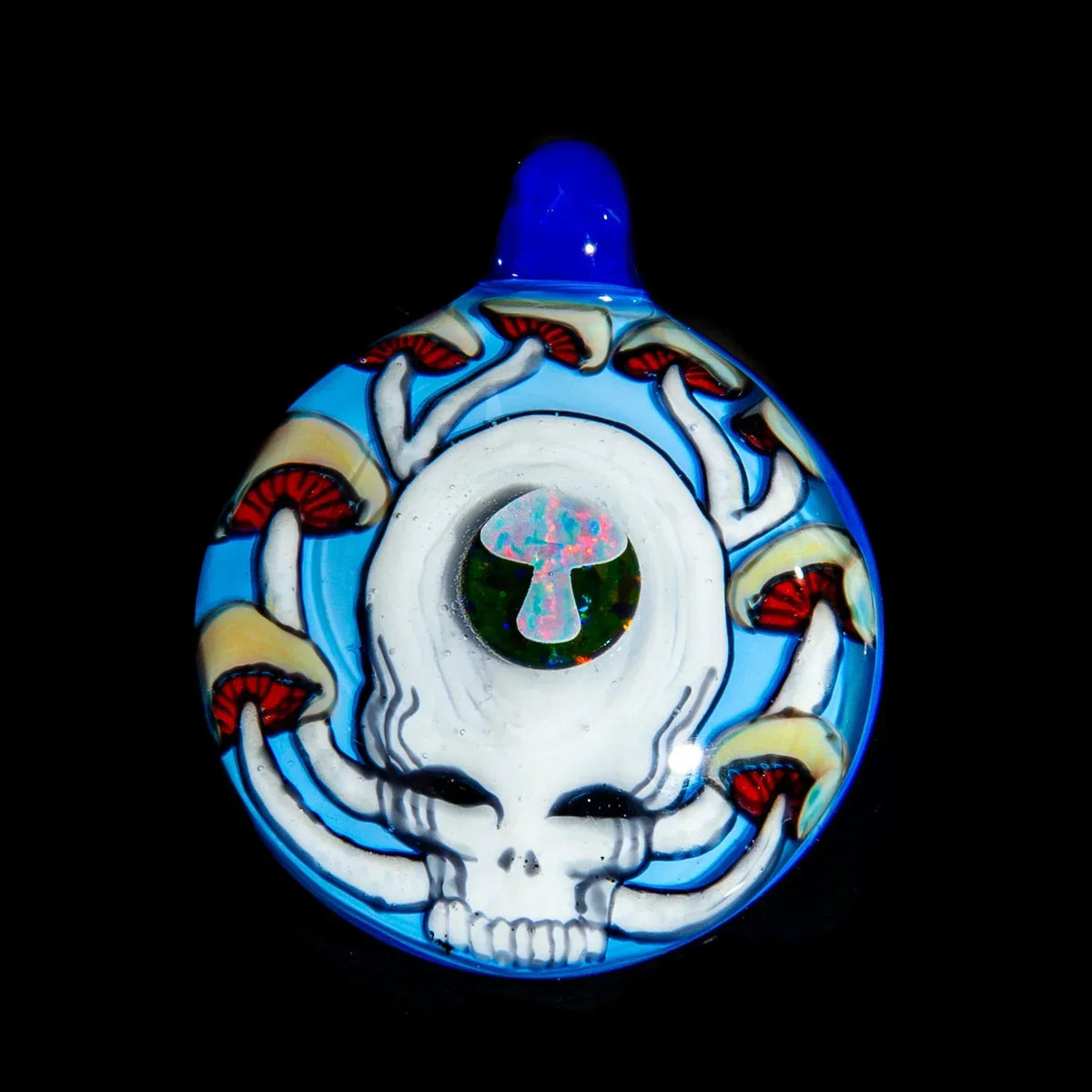 Glass pendant featuring a white skull, colorful mushrooms, and opal mushroom accent on blue