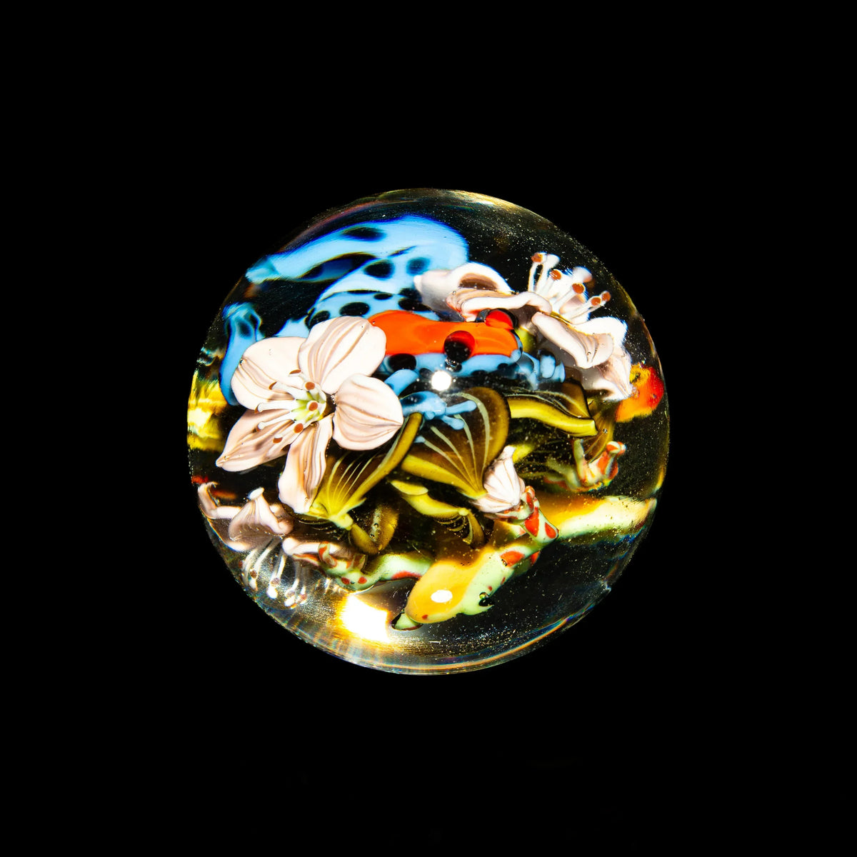 Intricate glass marble with colorful floral and aquatic designs, art glass photography