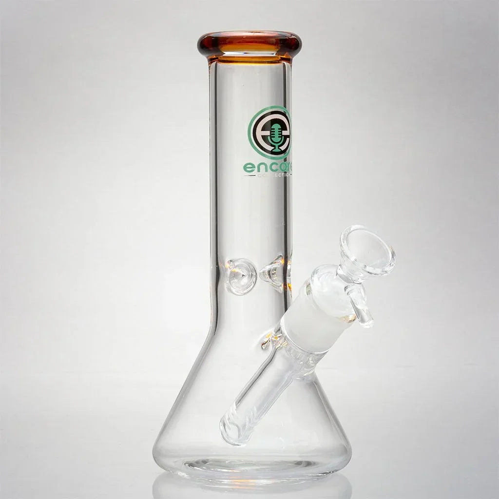Clear glass mini beaker bong with amber mouthpiece and Encore logo on white background