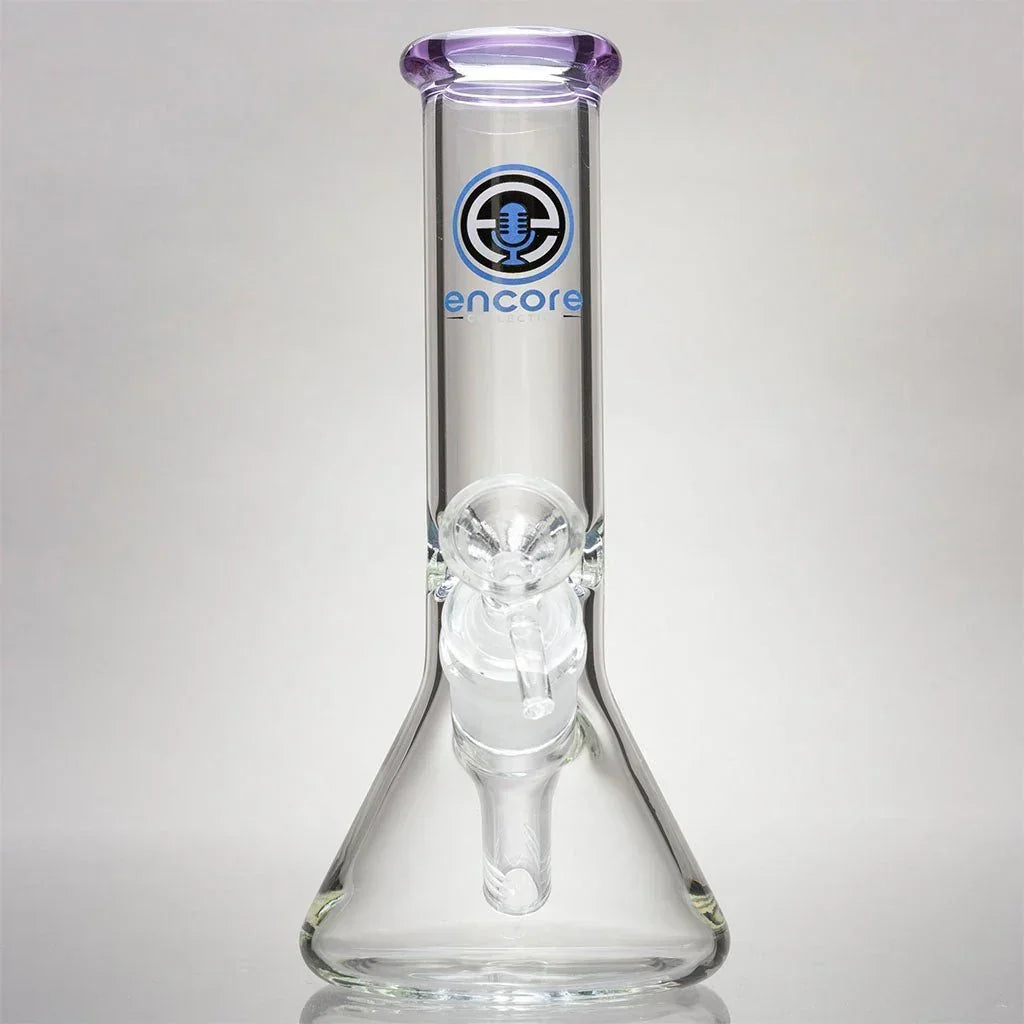 Clear glass mini beaker water pipe with purple mouthpiece and Encore logo on front