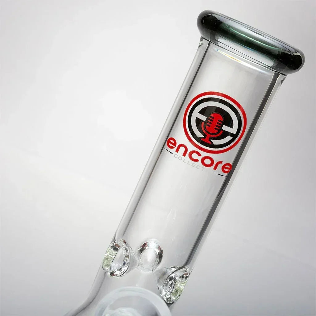 Close-up of Encore Collection clear glass mini beaker bong with logo on neck