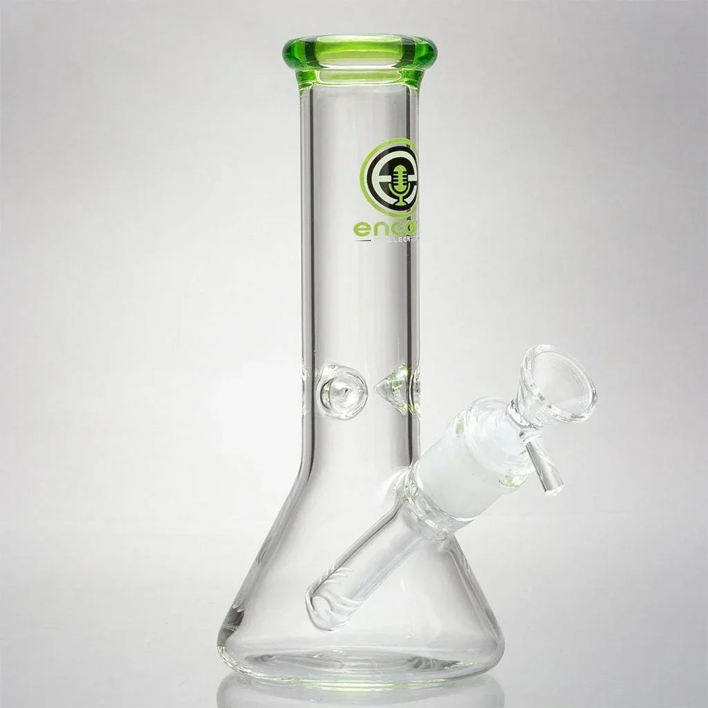 Clear glass mini beaker bong with green accents and Encore Collection logo, isolated on white.