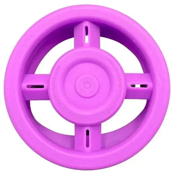 Purple silicone pipe protector wheel with cross design and center logo, top view.