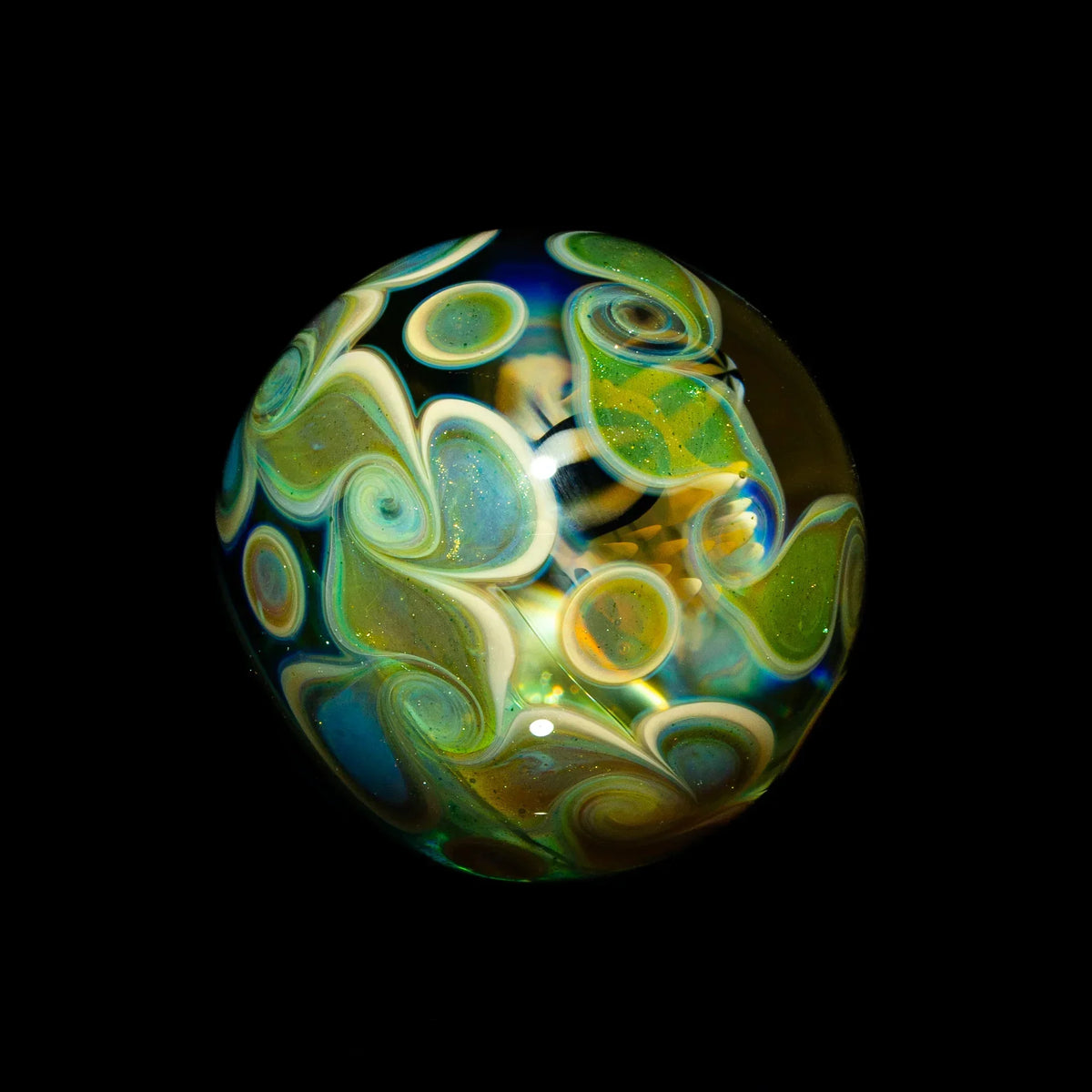 Heady glass marble with colorful spiral patterns and swirls on a black background