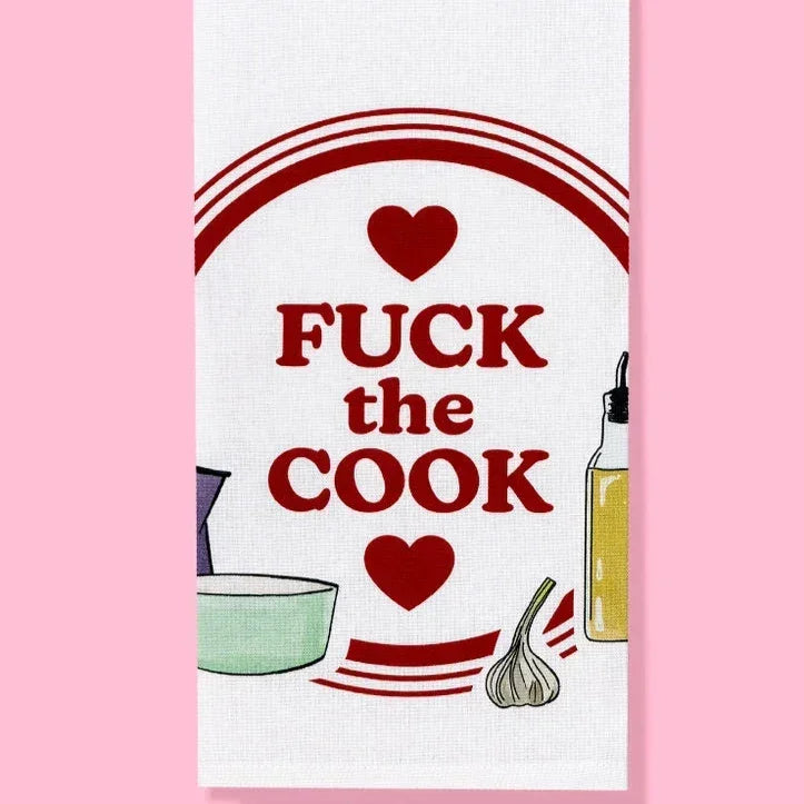 Funny kitchen towel with bold text, hearts, garlic, bowl, and olive oil illustration on pink background