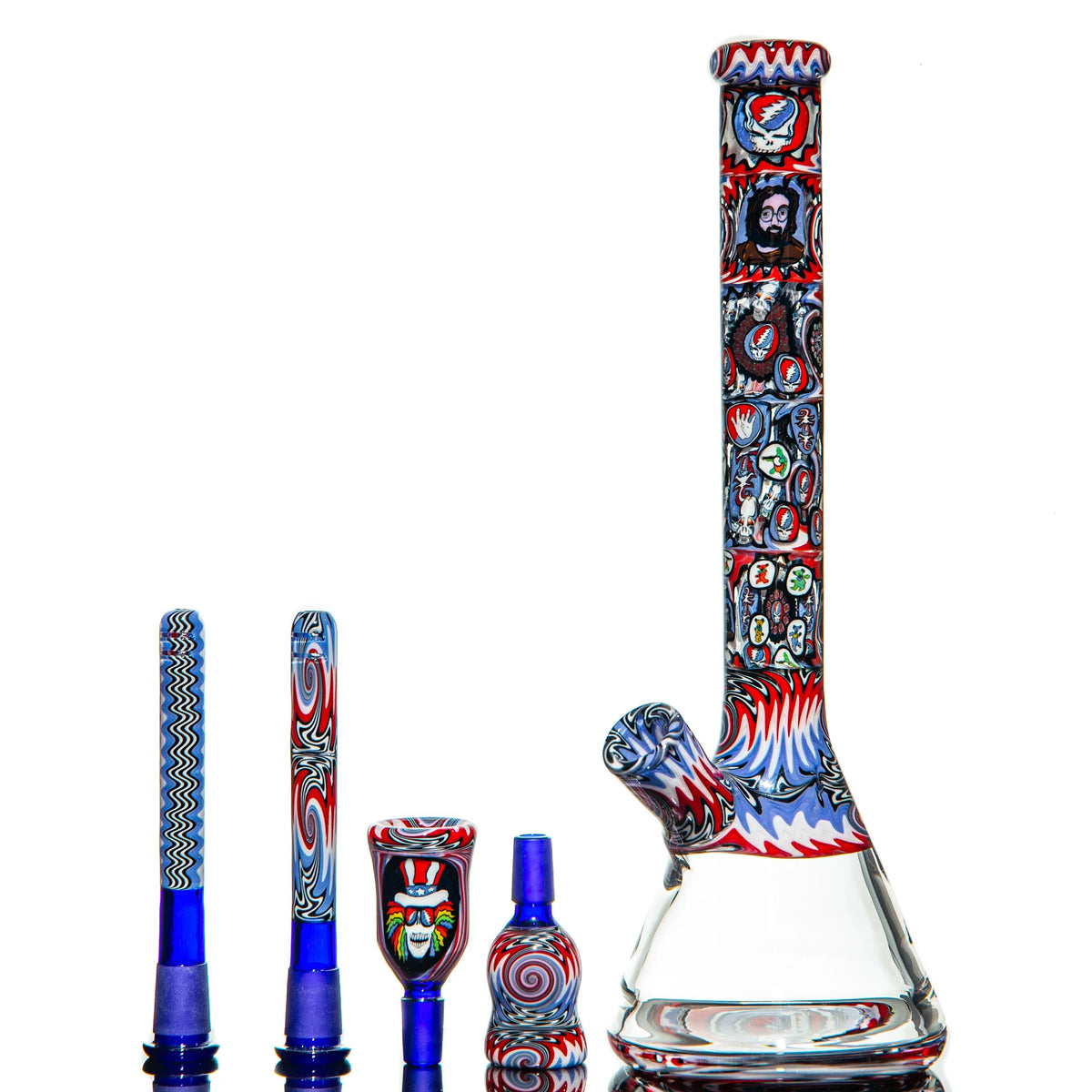 Colorful glass bong with Grateful Dead-inspired art and matching accessories on white background