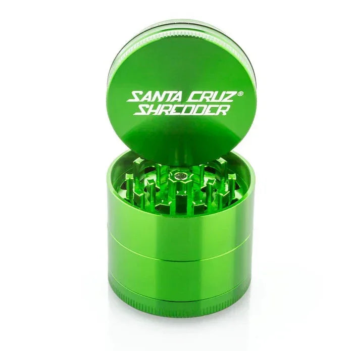 Green Santa Cruz Shredder herb grinder with open lid and visible grinding teeth