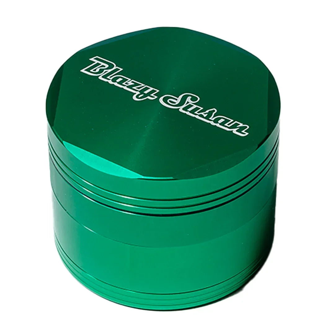 Green metal herb grinder with Blazy Susan logo, smoke shop accessory