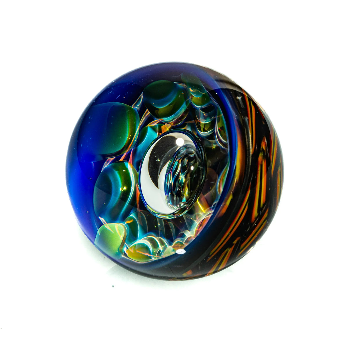 Handcrafted glass marble with vivid blue, green, and orange swirling patterns