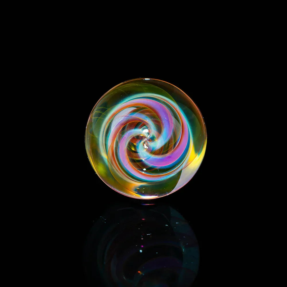 Heady glass marble with colorful spiral design on black background