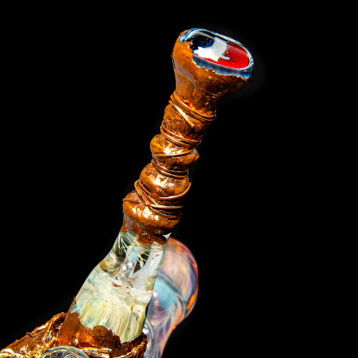 Handcrafted glass pipe with copper wire accents and colorful detail on black background