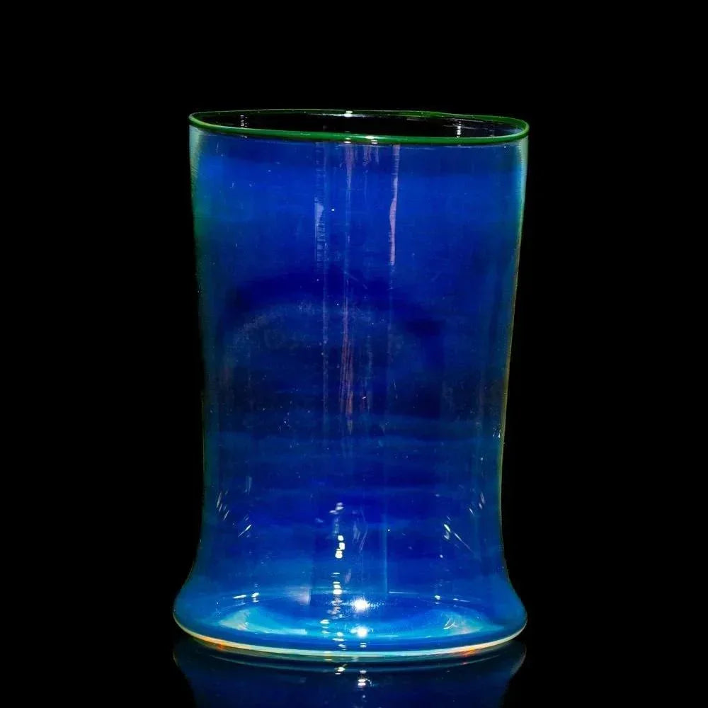 Handblown blue glass smoking accessory with flared base on a black background