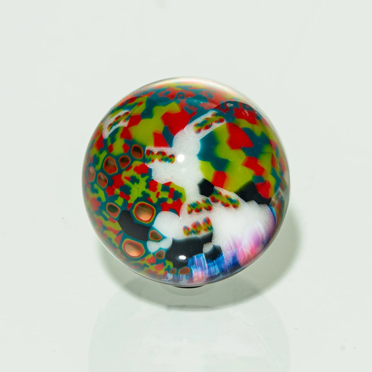Colorful heady glass marble with intricate patterns and vibrant abstract designs