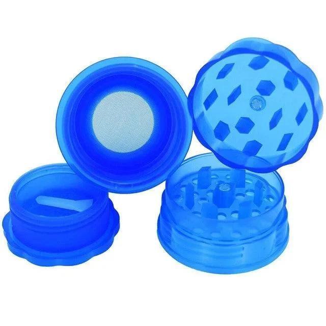 Large blue plastic herb grinder with multi-chamber design and sifter screen.