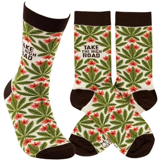 Colorful crew socks with green leaf and red flower design, 'Take the High Road' text