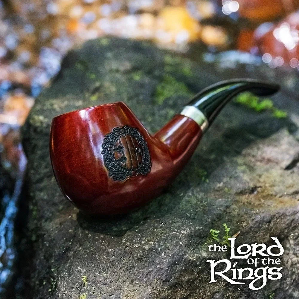 Lord of the Rings Hobbiton pipe with engraved design on rock in nature setting