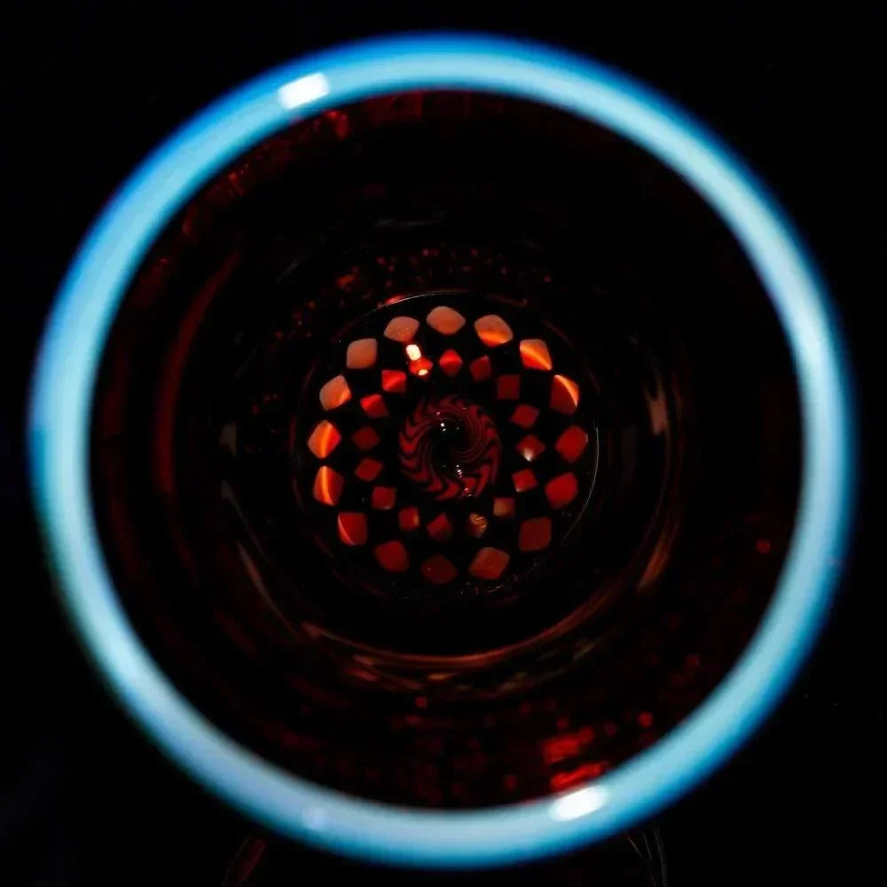 Close-up of intricate glass pipe with colorful, spiral-patterned glasswork design
