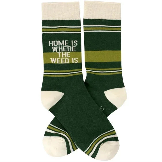 Green novelty socks with 'Home is where the weed is' text and white toe accents