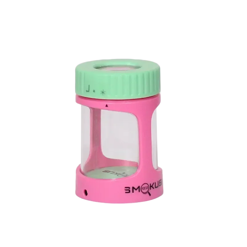 Pink and mint green Smokus Focus glass storage jar with magnifying lid and clear window