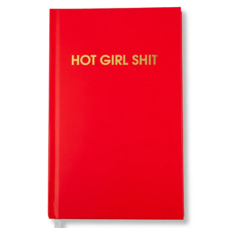 Red hardcover notebook with gold text 'HOT GIRL SHIT' on the cover