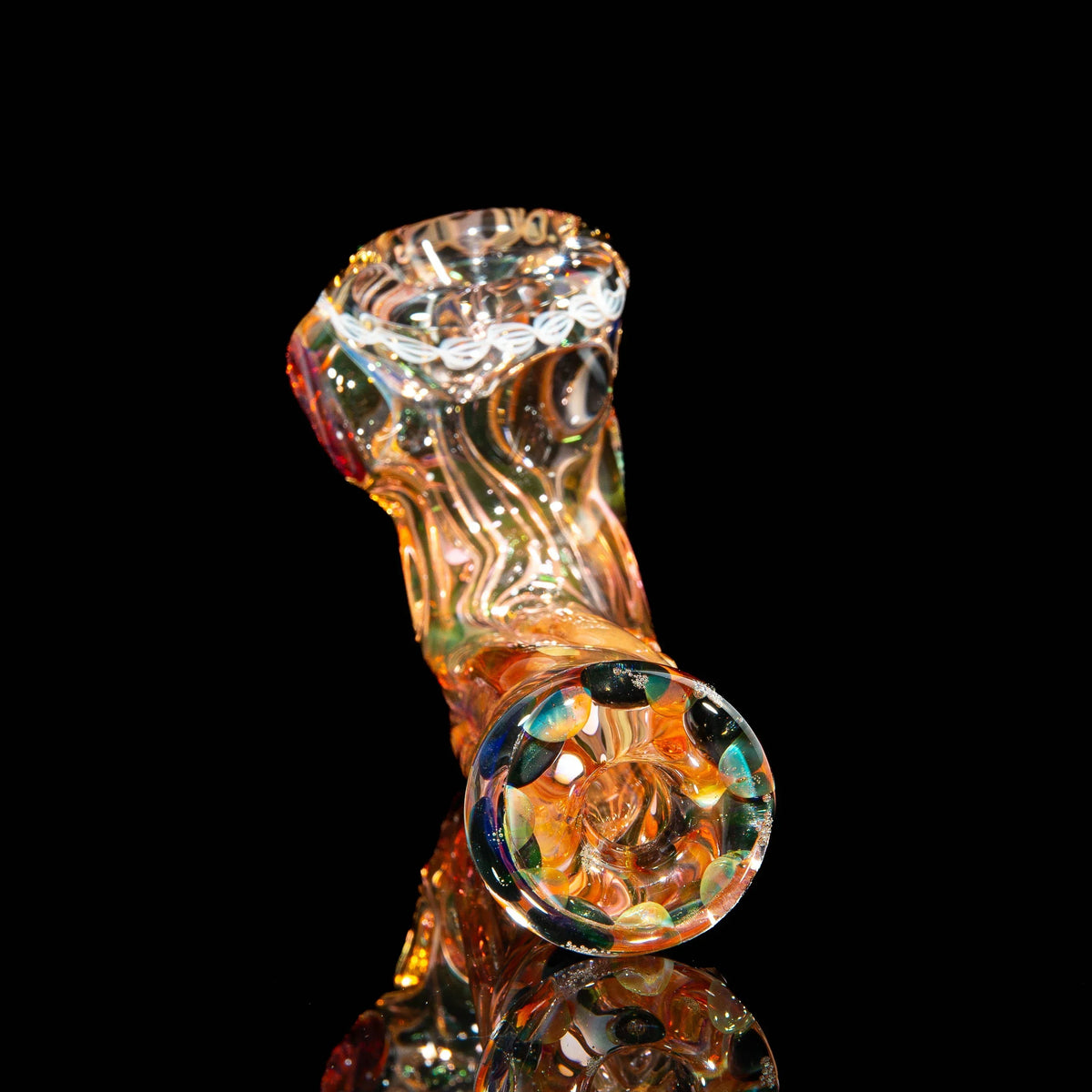 Colorful hand-blown glass pipe with swirling patterns and marbles on black background