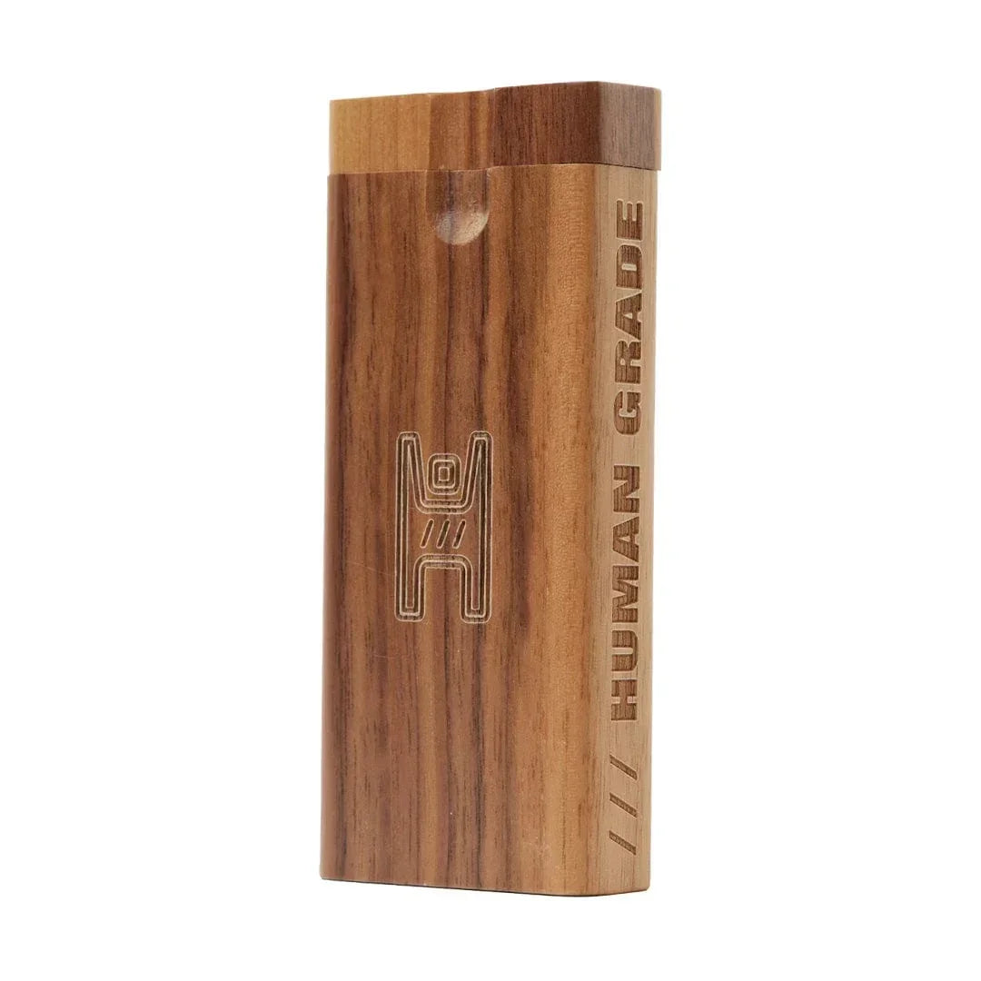 Walnut wooden dugout with engraved human figure and 'HUMAN GRADE' text on side